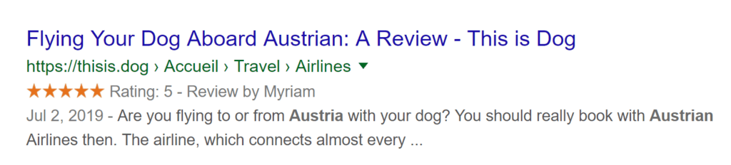 revue 5 étoile austrian airlines avec un chien